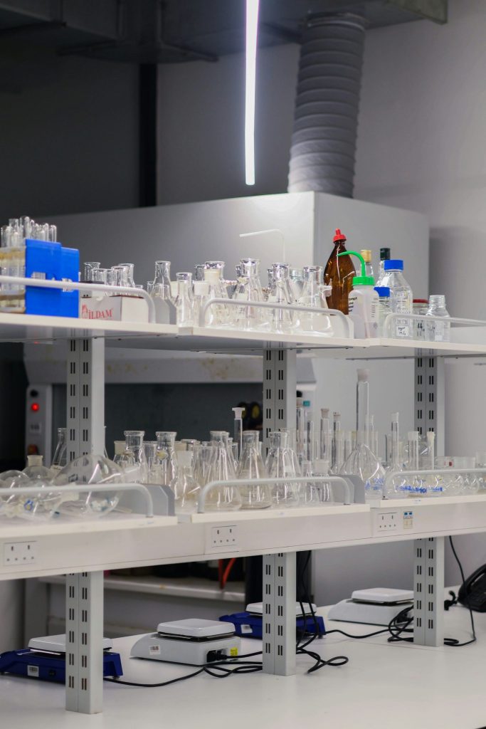 Laboratory shelves filled with glassware and equipment